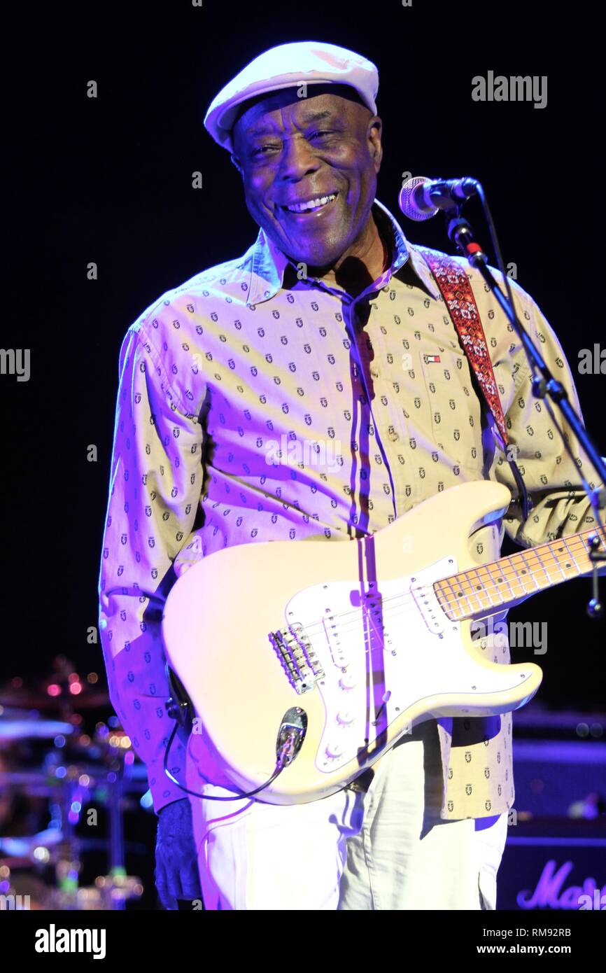 Guitarist Buddy Guy is shown performing on stage during a "live