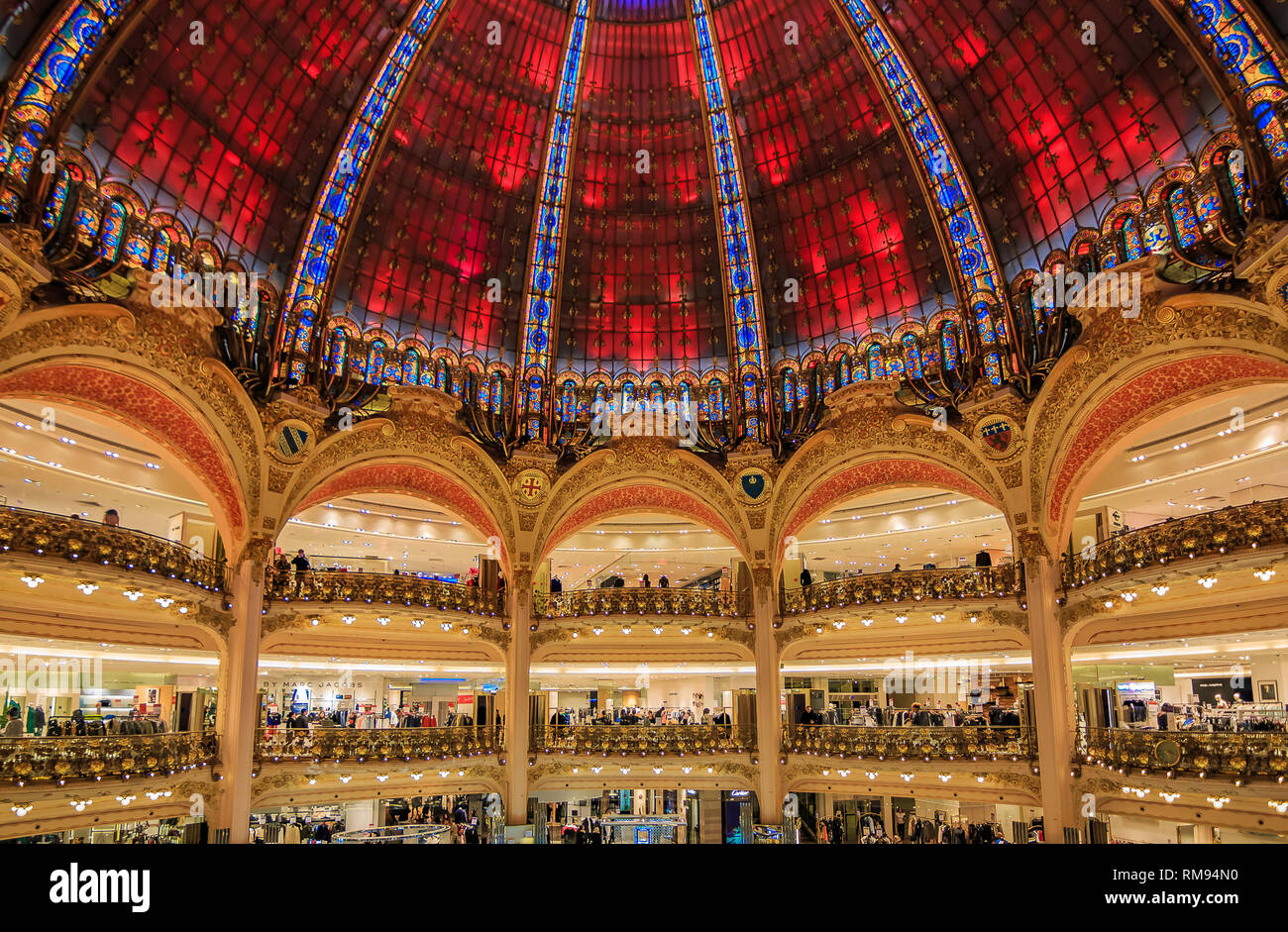 Paris, France - January 21, 2015: Art Nouveau decor and neo-Byzantine tinted dome windows of the iconic flagship Galeries Lafayette French department  Stock Photo