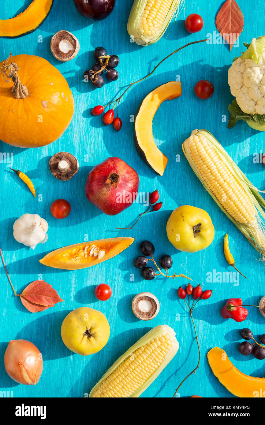 Various fresh fruits and vegetables on blue background Stock Photo - Alamy