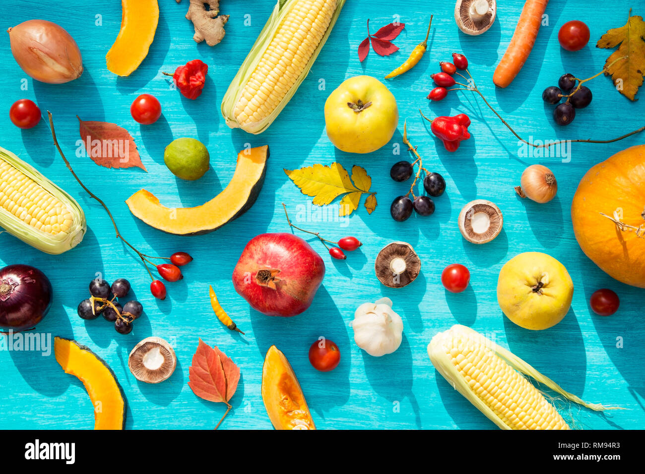 Various fresh fruits and vegetables on blue background Stock Photo - Alamy