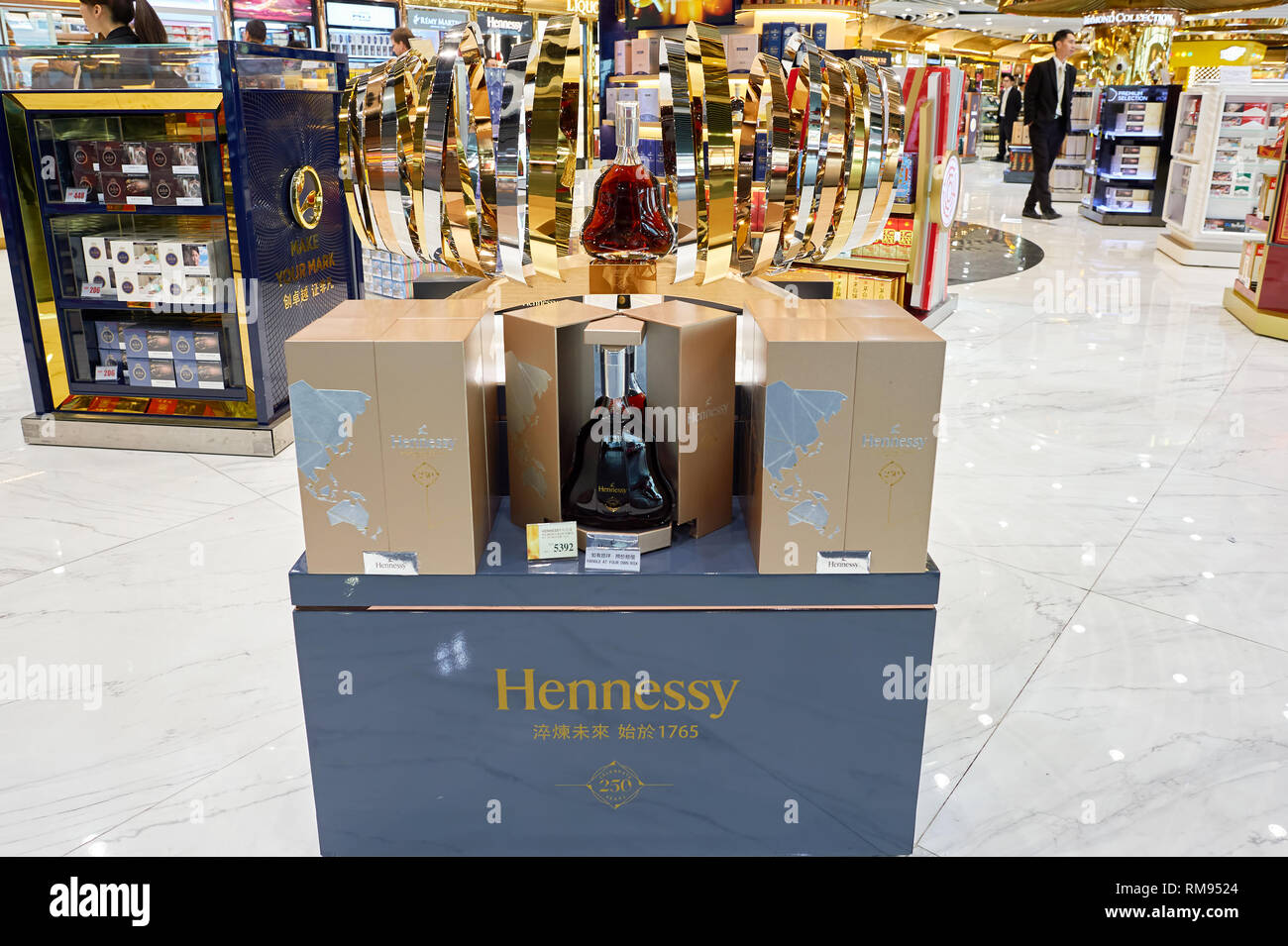 MACAO - CIRCA FEBRUARY, 2016: Hennessy bottle displayed in a store at Macao International Airport. Hennessy, is a cognac house with headquarters in Co Stock Photo