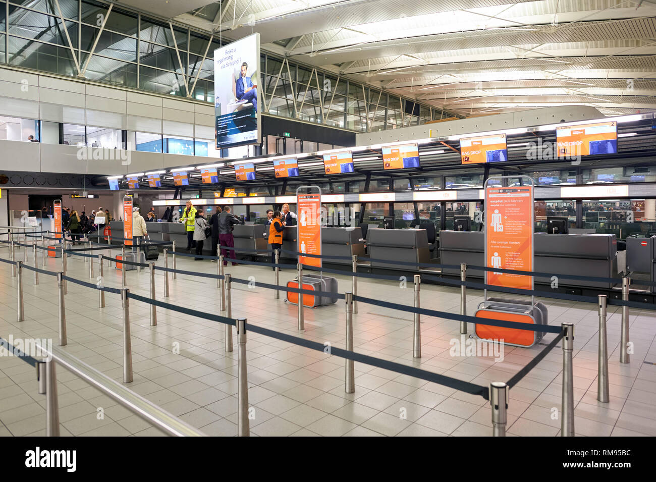 AMSTERDAM, NETHERLANDS - CIRCA NOVEMBER, 2015: check-in counters at Schiphol Airport. Amsterdam Airport Schiphol is the main international airport of  Stock Photo