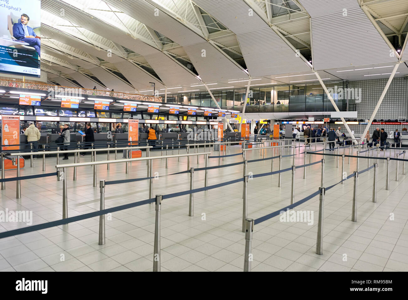 AMSTERDAM, NETHERLANDS - CIRCA NOVEMBER, 2015: check-in counters at Schiphol Airport. Amsterdam Airport Schiphol is the main international airport of  Stock Photo