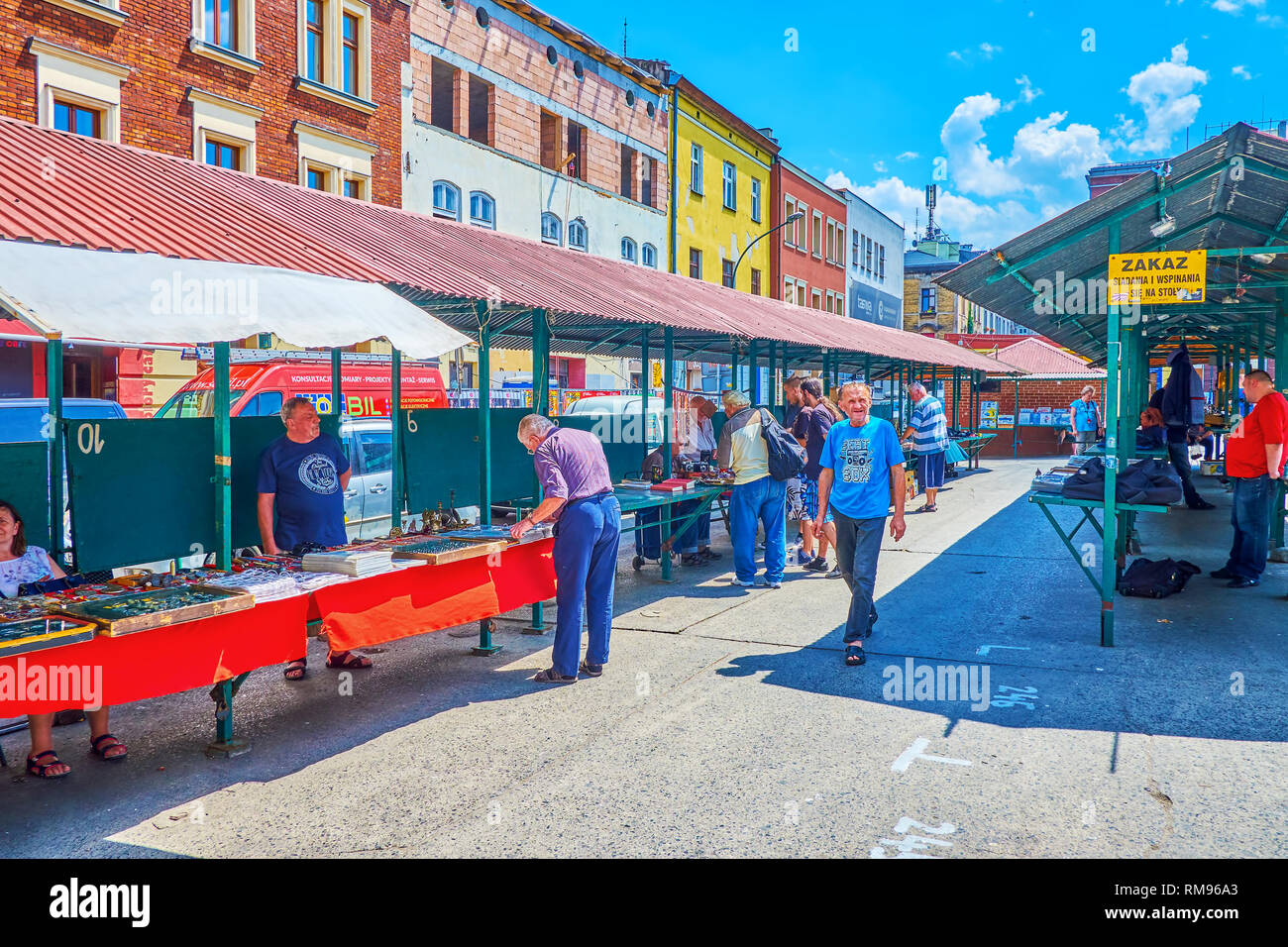 KRAKOW, POLAND - JUNE 21, 2018: The lines of covered stalls in New Square (Plac Nowy) serves as the small flea market with variety of old  souvenirs,  Stock Photo