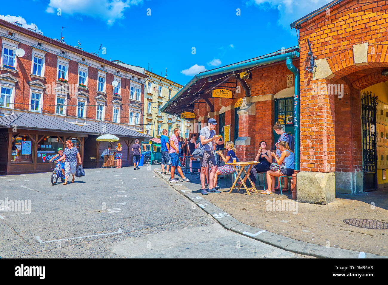 KRAKOW, POLAND - JUNE 21, 2018: The best places to have a fast lanch is to visit one of the street food cafes at Okraglac, the covered pavilion in the Stock Photo