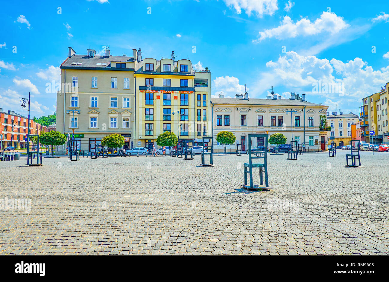 KRAKOW, POLAND - JUNE 21, 2018: The large Ghetto Heroes Square with empty metal chairs is an open air memorial place, commemorable to victims of WWII, Stock Photo