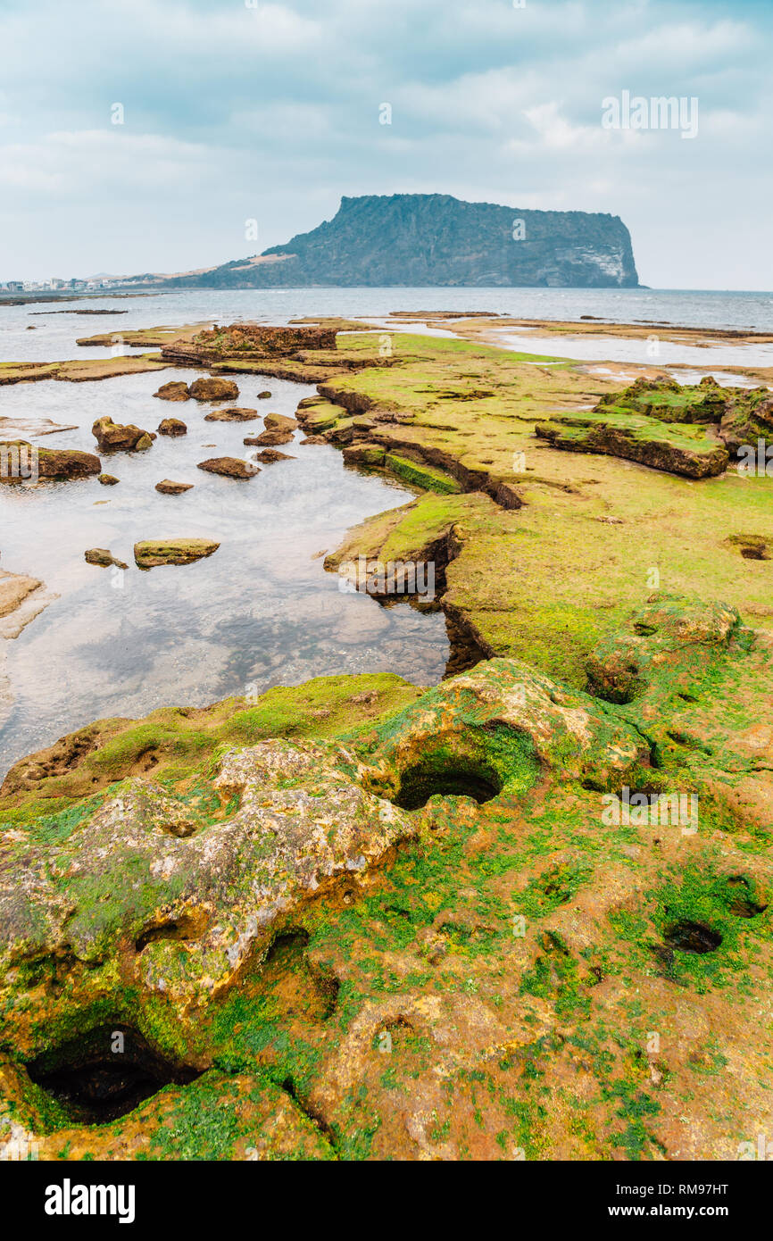 Seongsan Ilchulbong Tuff Cone and Gwangchigi Beach in Jeju Island, Korea Stock Photo