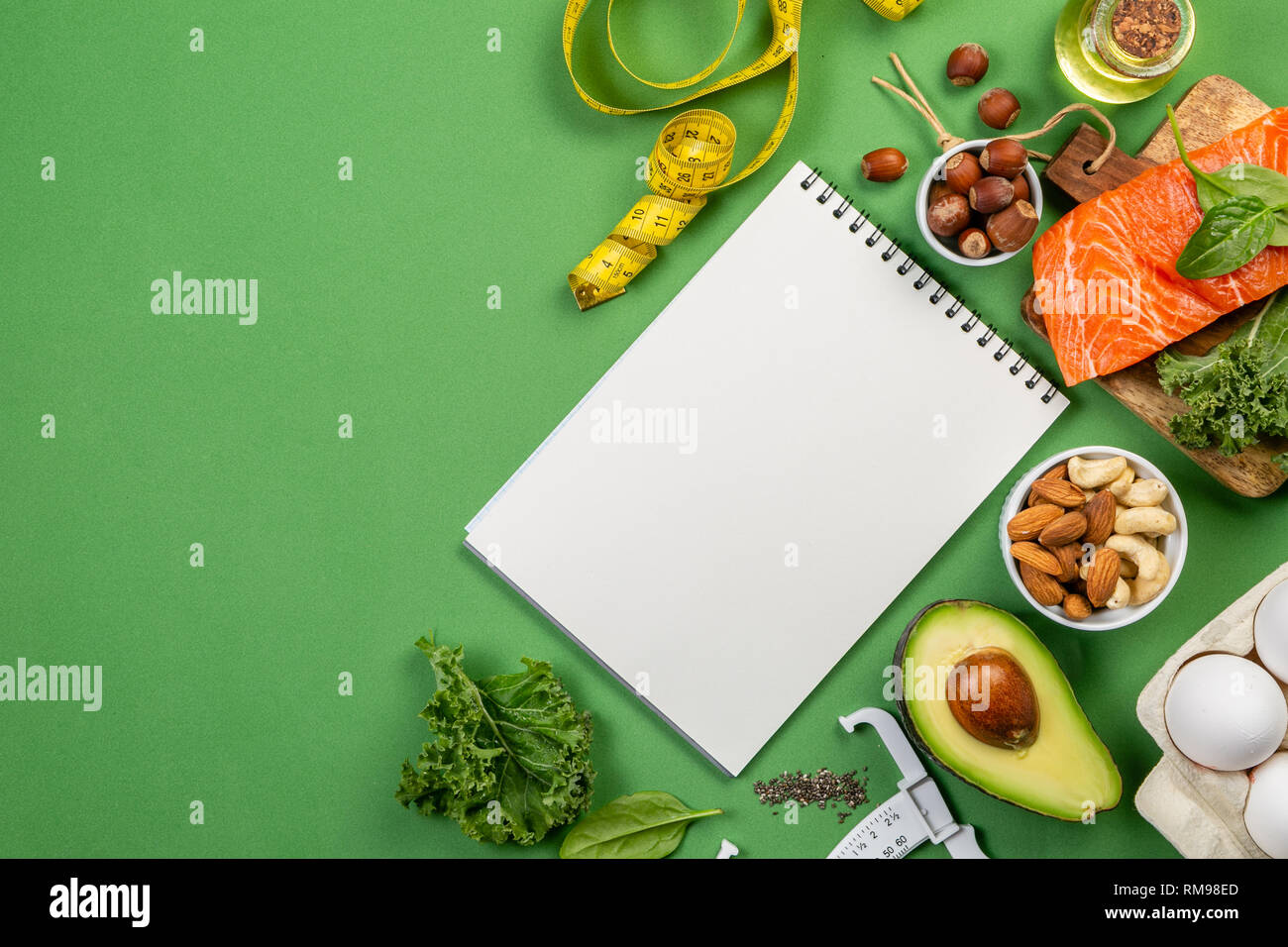 Keto diet concept salmon, avocado, eggs, nuts and seeds Stock Photo