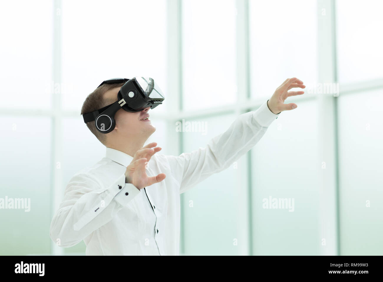 young employee is testing virtual reality glasses Stock Photo
