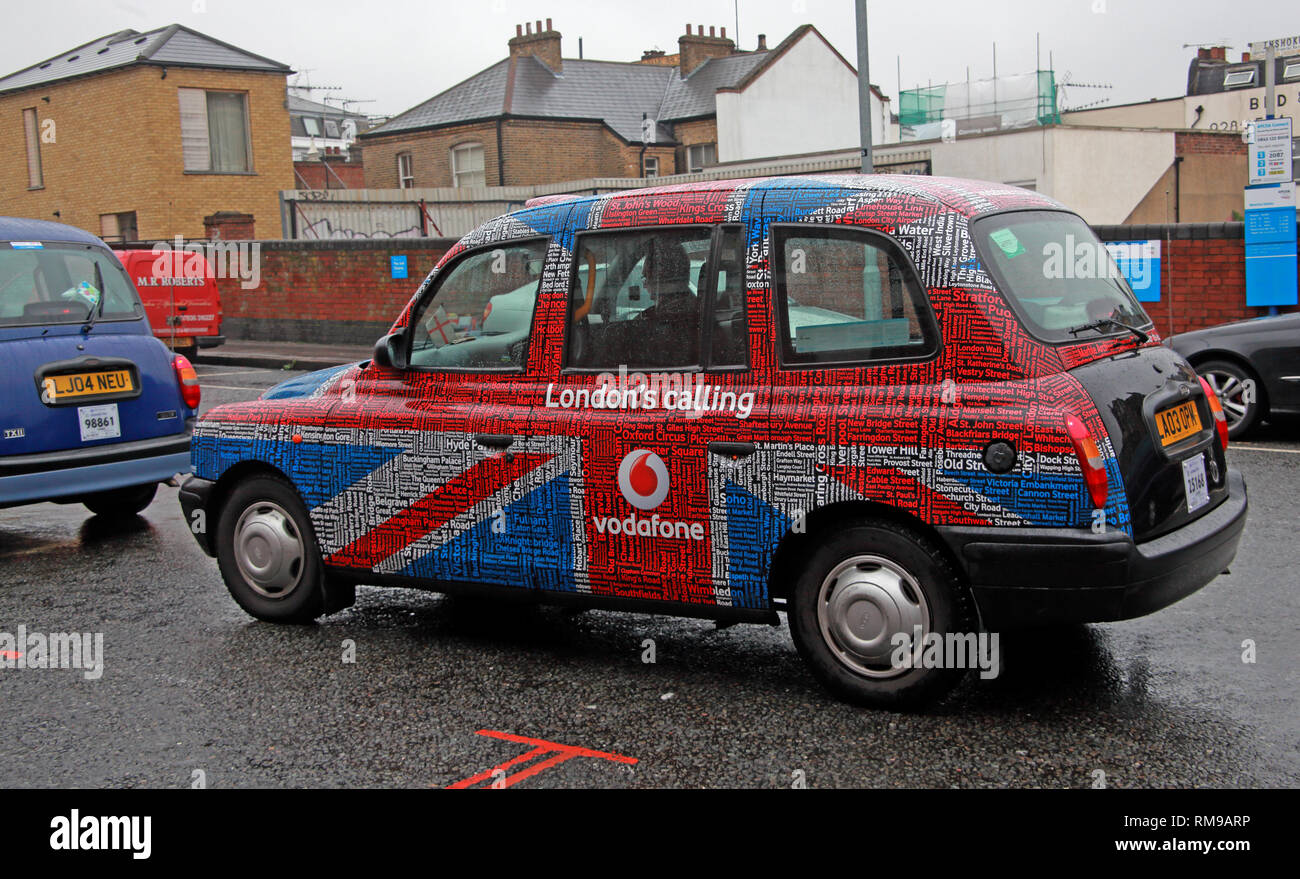 London Taxi Cab, in branded advertising livery Vodafone, Londons Calling, with Union Flag, Waterloo, Lambeth, South east England, UK Stock Photo