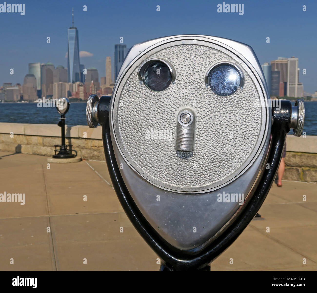 Silver / Steel PayToView coin operated binoculars, Ellis Island, New York Harbour, view of lower Manhattan, NYC, USA, United States of America Stock Photo