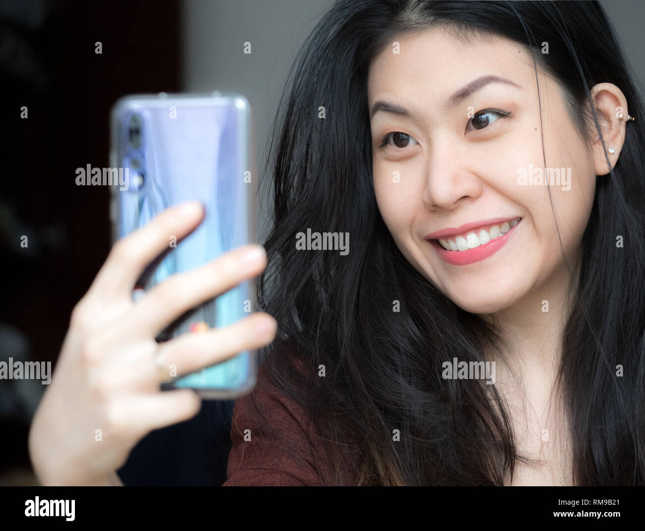 Beautiful young woman smiling waving hires stock photography and