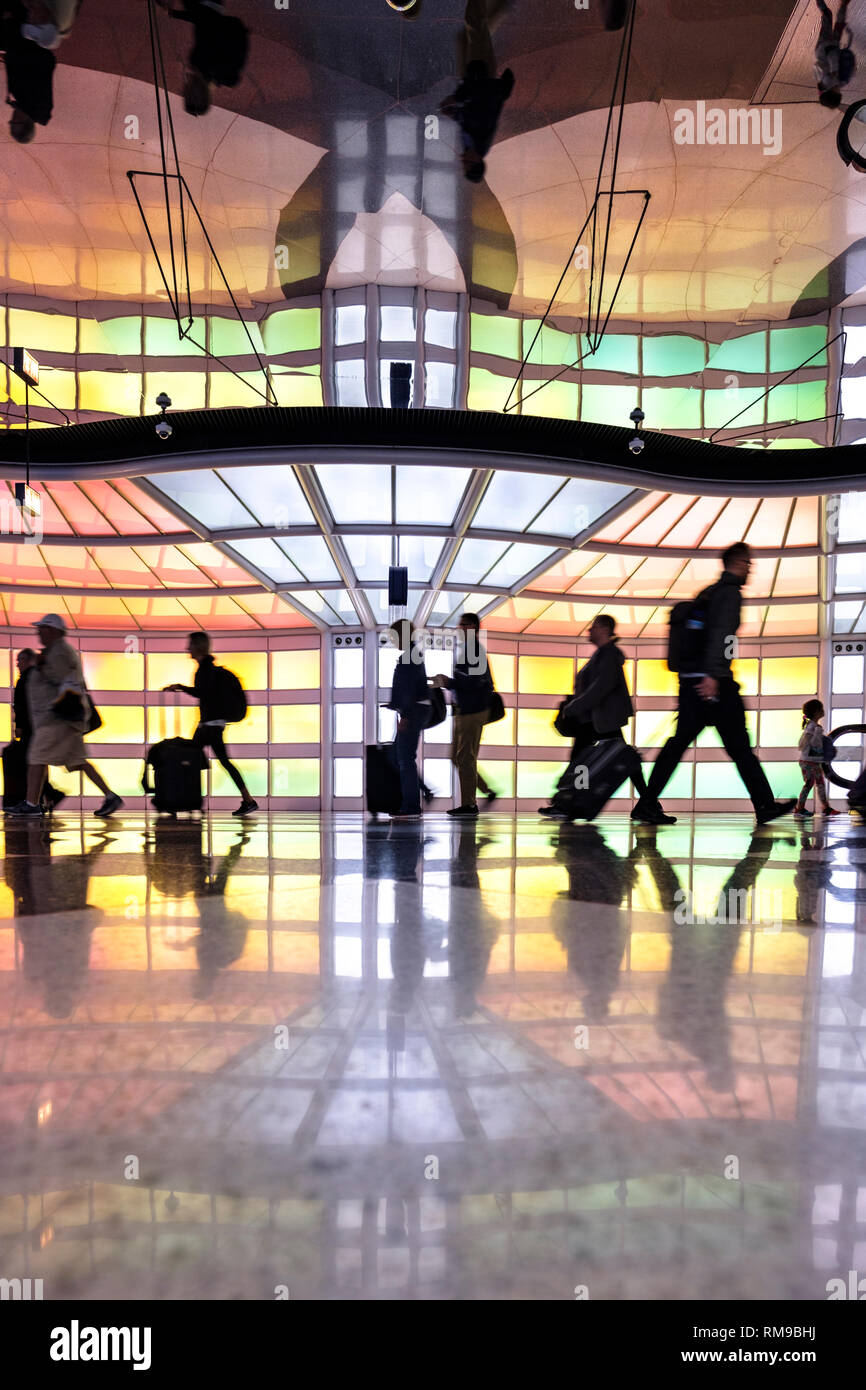 Air passengers, people walking, neon lights art installation by Michael Hayden, pedestrian tunnel, Chicago O'Hare International Airport Terminal, USA Stock Photo
