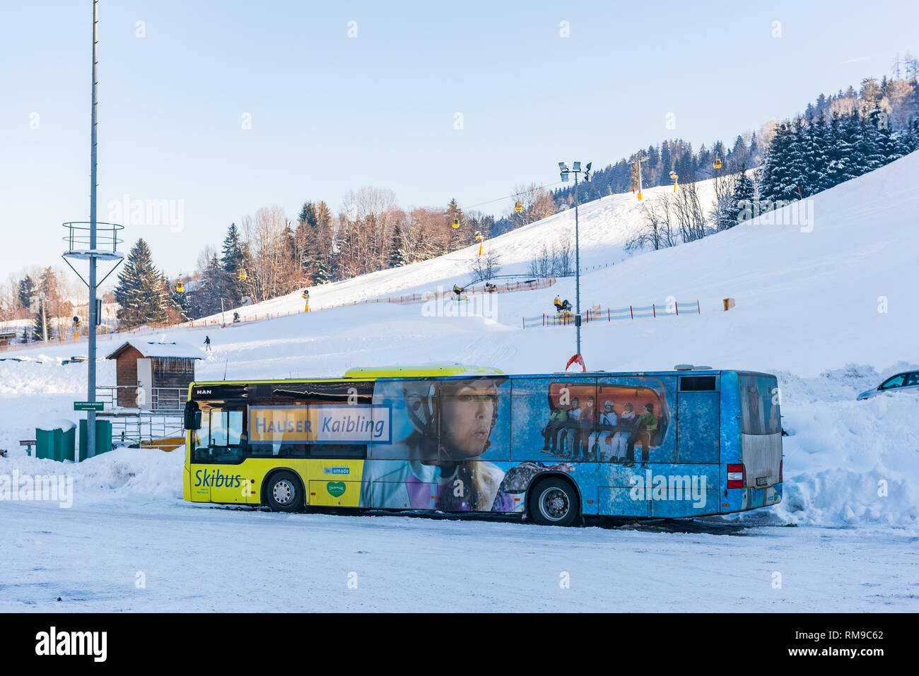 MAN Ski bus at ski region Schladming Dachstein - Hauser Kaibling with mountain at the background. Ski Amade, Liezen District, Styria, Austria, Europe Stock Photo