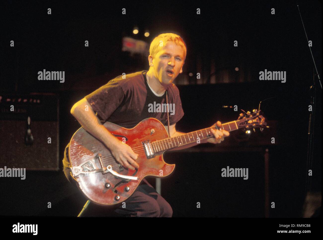 Cake lead guitarist Greg Brown is shown performing on stage during a 'live' concert appearance. Stock Photo