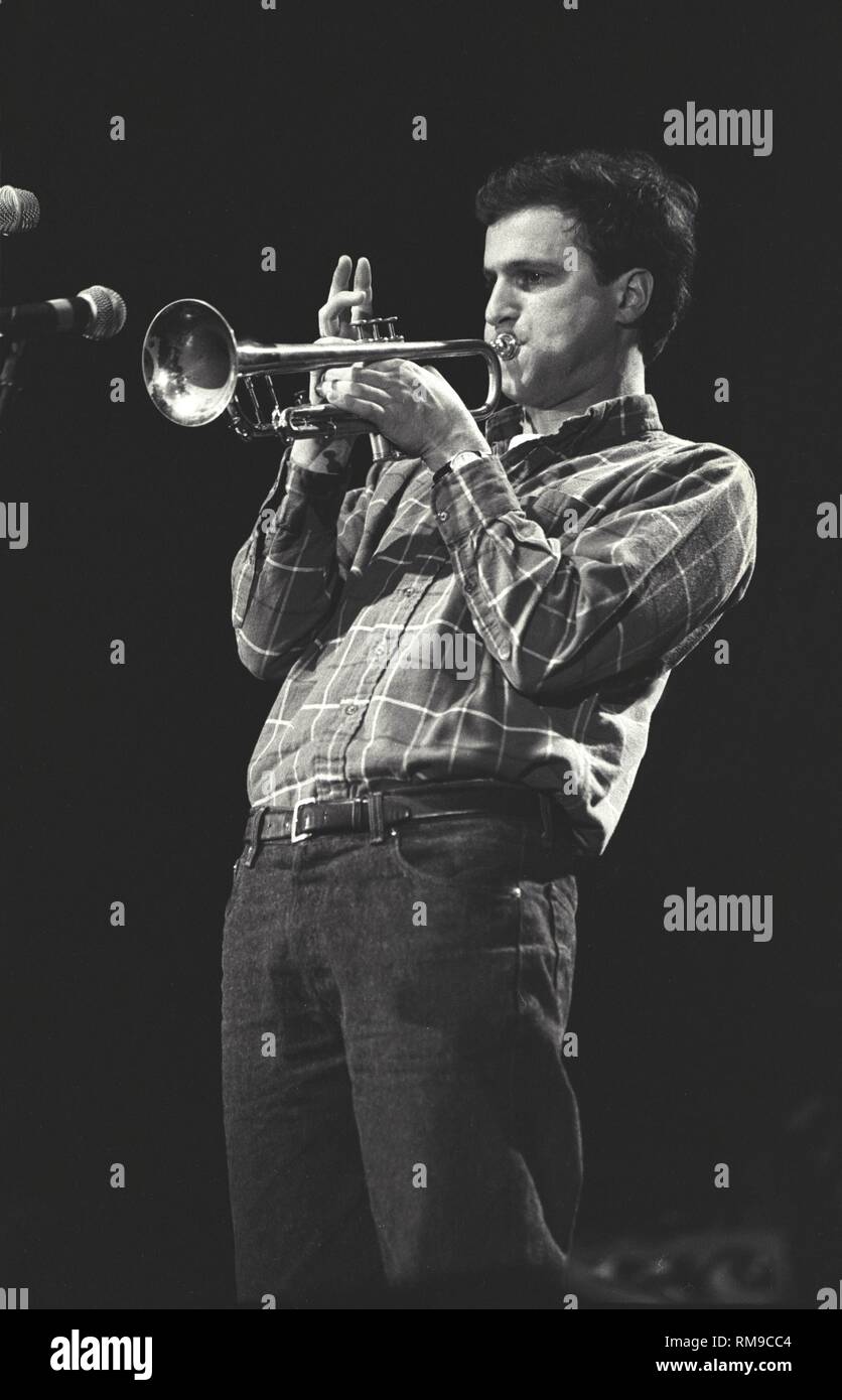 Cake trumpet player Vince DiFiore is shown performing on stage during a 'live' concert appearance. Stock Photo