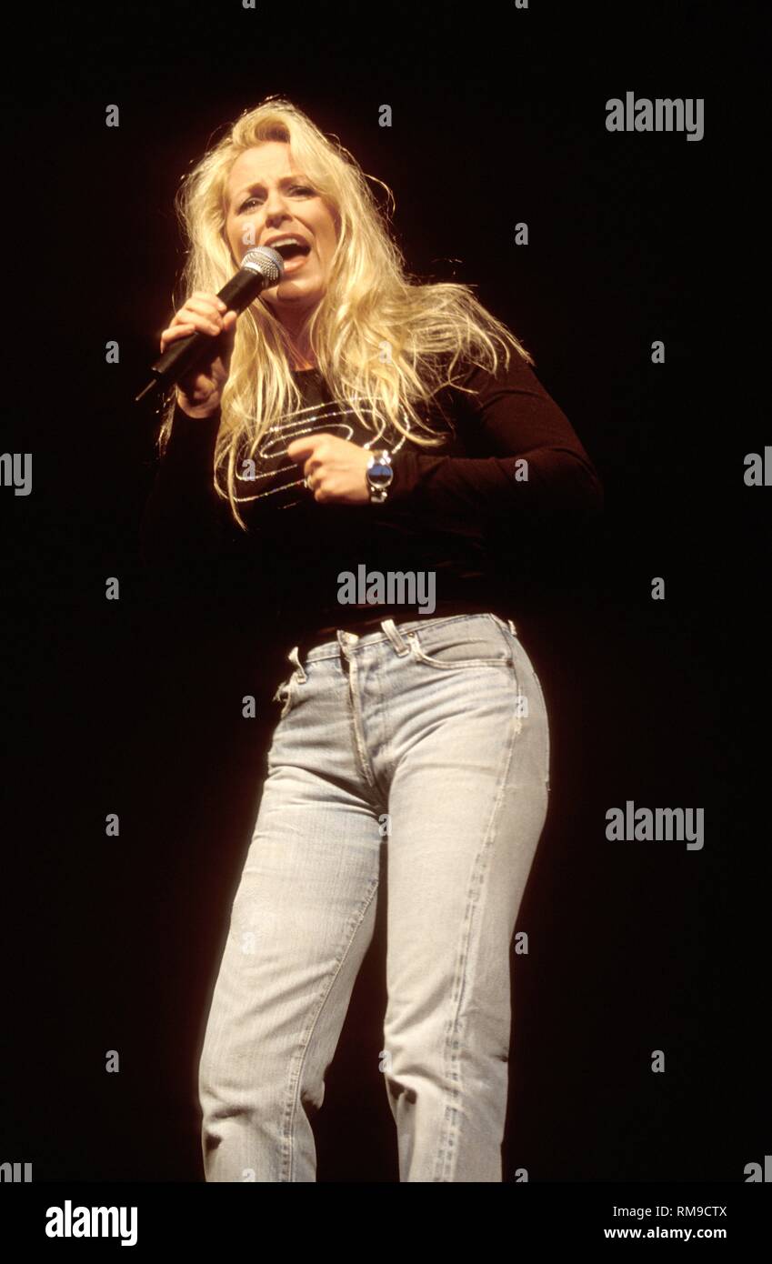 Deana Carter is shown performing on stage during a "live" concert