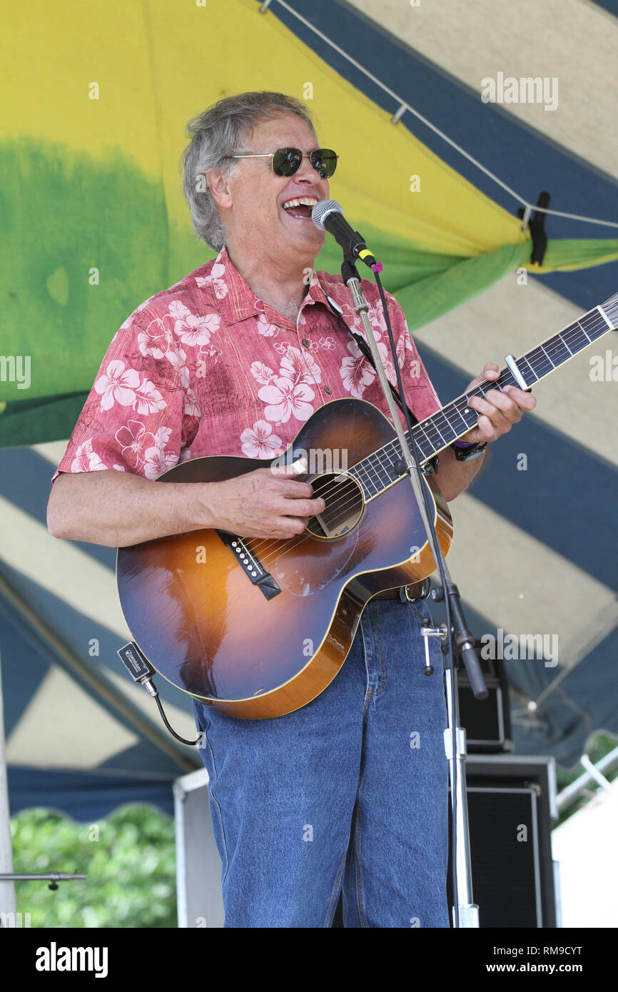 Musician Tom Chapin is shown performing on stage during a 'live' concert appearance. Stock Photo