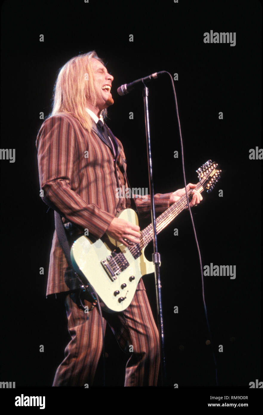Cheap Trick guitarist Robin Zander is shown peforming "live" in concert