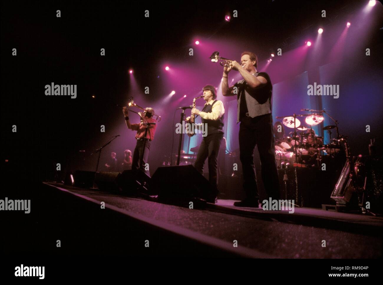 Chicago band members are shown performing on stage during a 'live' concert performance. Stock Photo