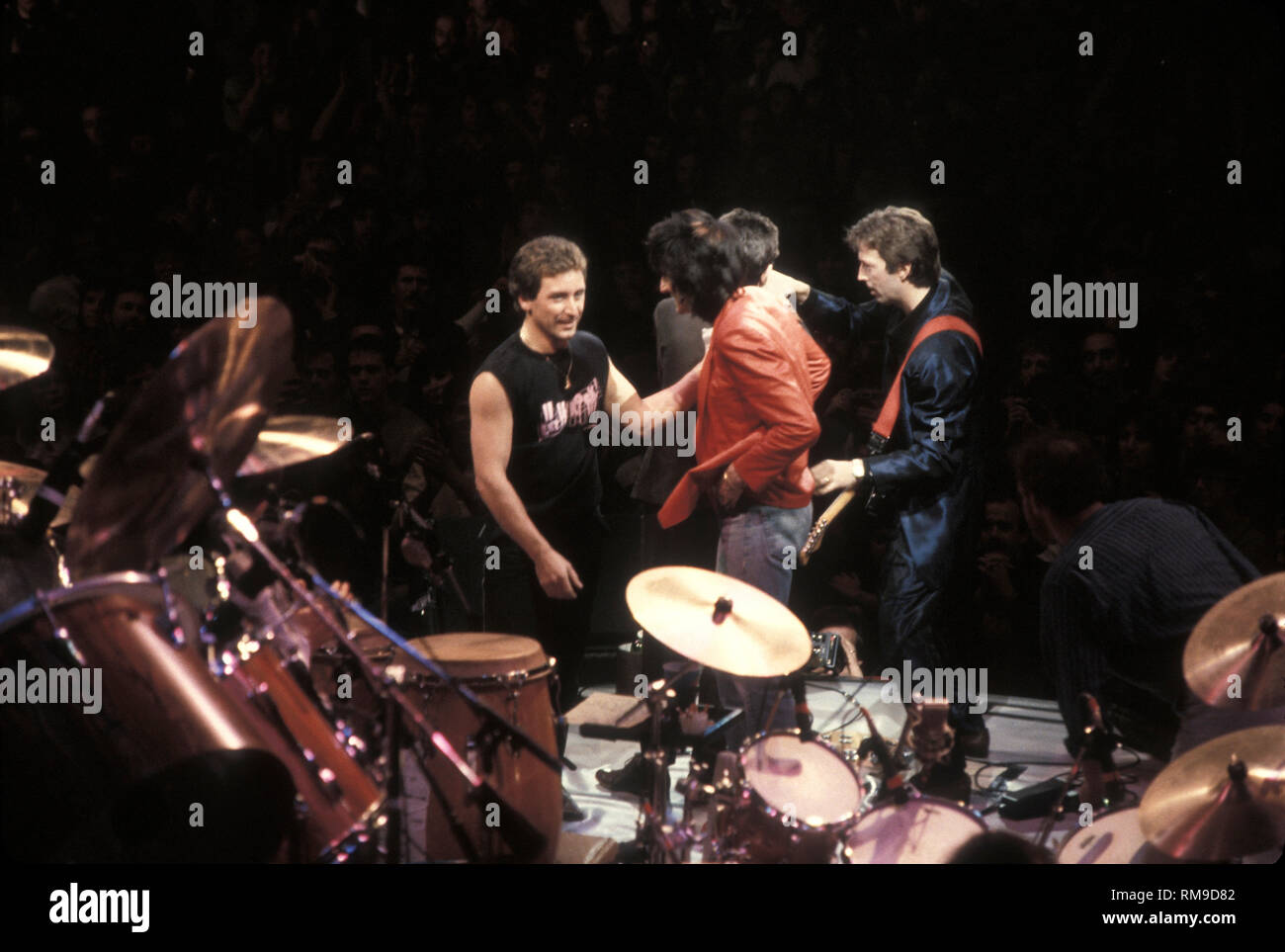Eric Clapton is shown on stage with Ron Wood, Kenny Jones, and Ronnie Lane during the Ronnie Lanes A.R.M.S. benefit concert at Madison Square Garden. Stock Photo