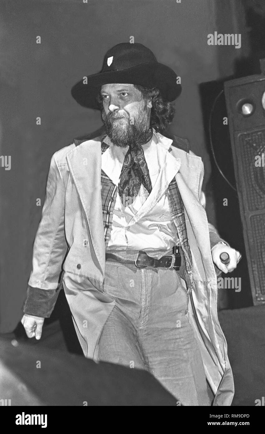 Musician Ian Anderson is shown performing on stage during a "live