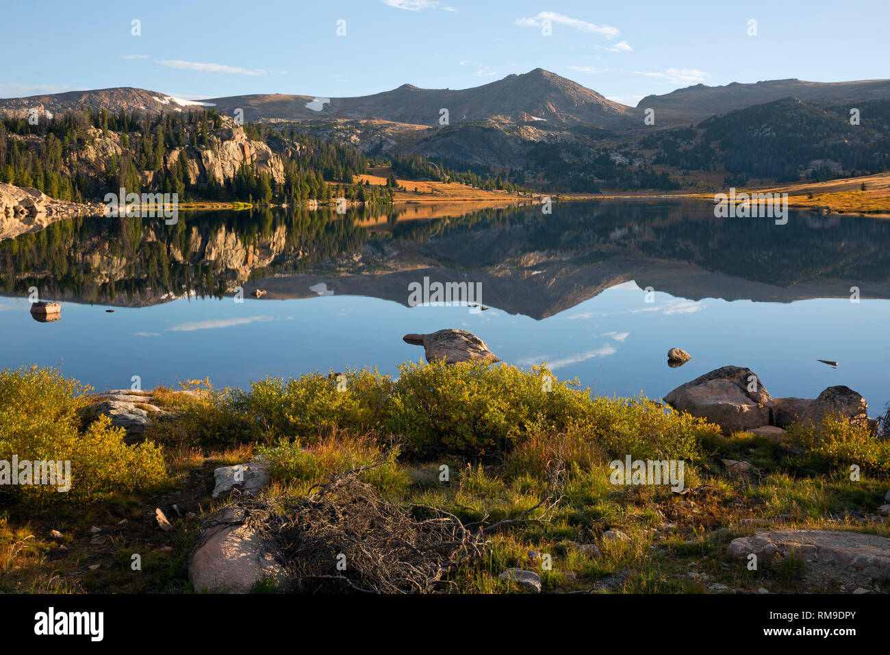WY03719-00...WYOMING - The Beartooth Mountains reflecting in Long Lake located along the Beartooth Highway in the Shoshone National Forest. Stock Photo