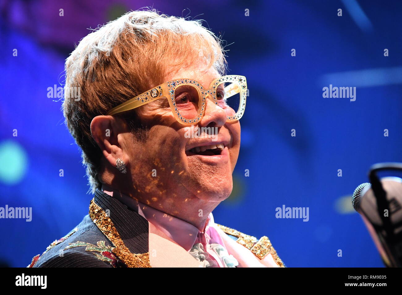 Musician Elton John is shown performing on stage during his 'Farewell Yellow Brick' concert tour. Stock Photo