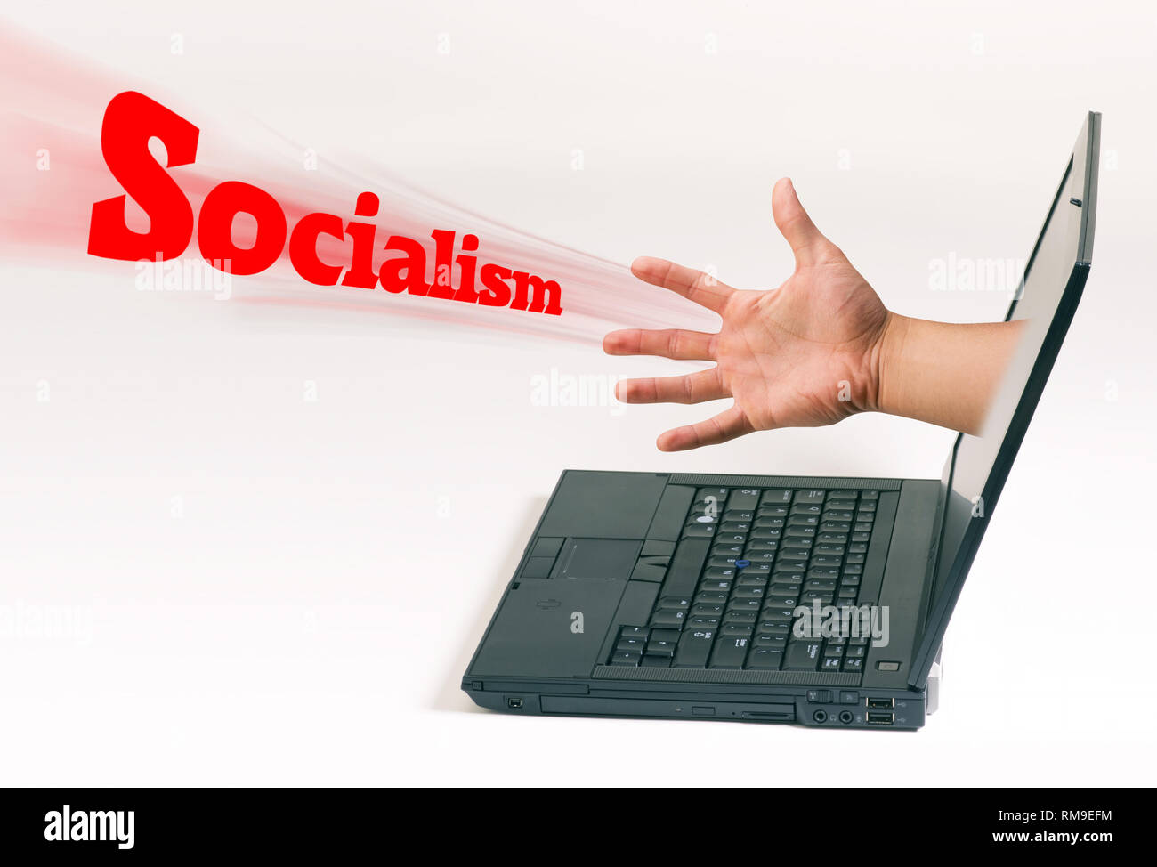 Hand coming out of computer pushi'ng Socialism. Stock Photo