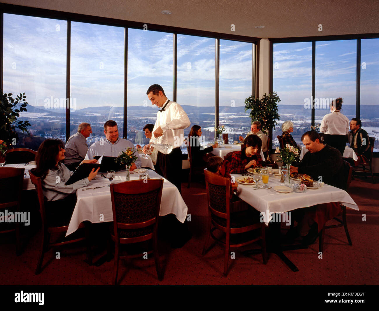 Waiters and customers in the 'Top of the 80's' restaurant, Hazleton, Pennsylvania, USA Stock Photo