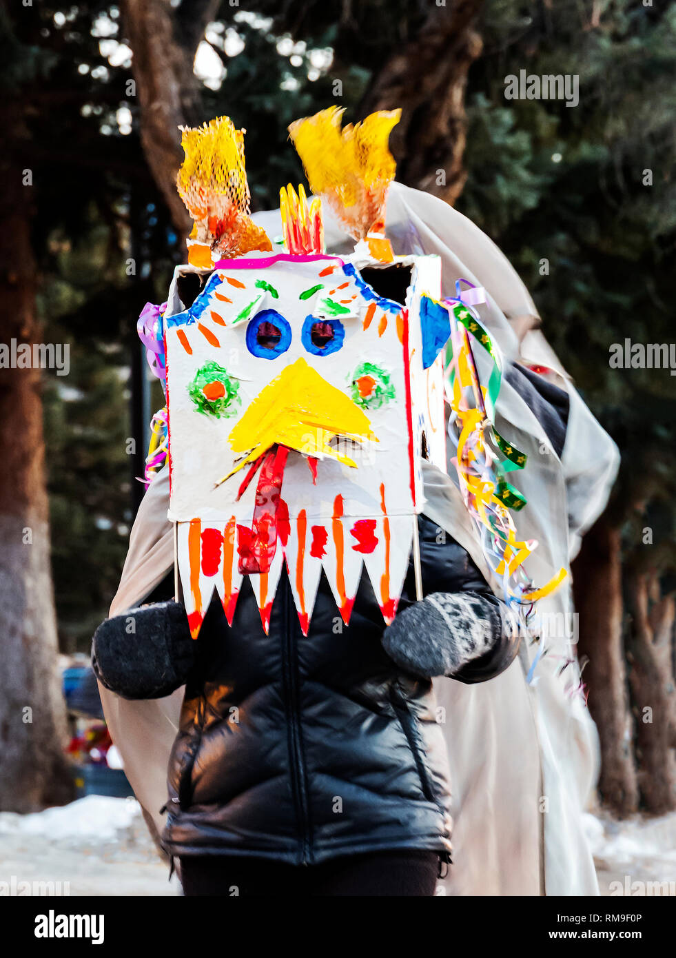 Children & adults dance in fancy costumes at Salida's 3rd annual Lunar New Year Parade. The year of the Pig. Stock Photo