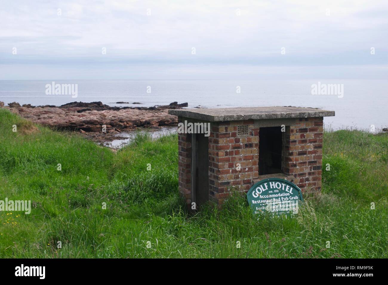 Old Brick Hut and Crail Golf Hotel Sign along the Fife Coastal Path