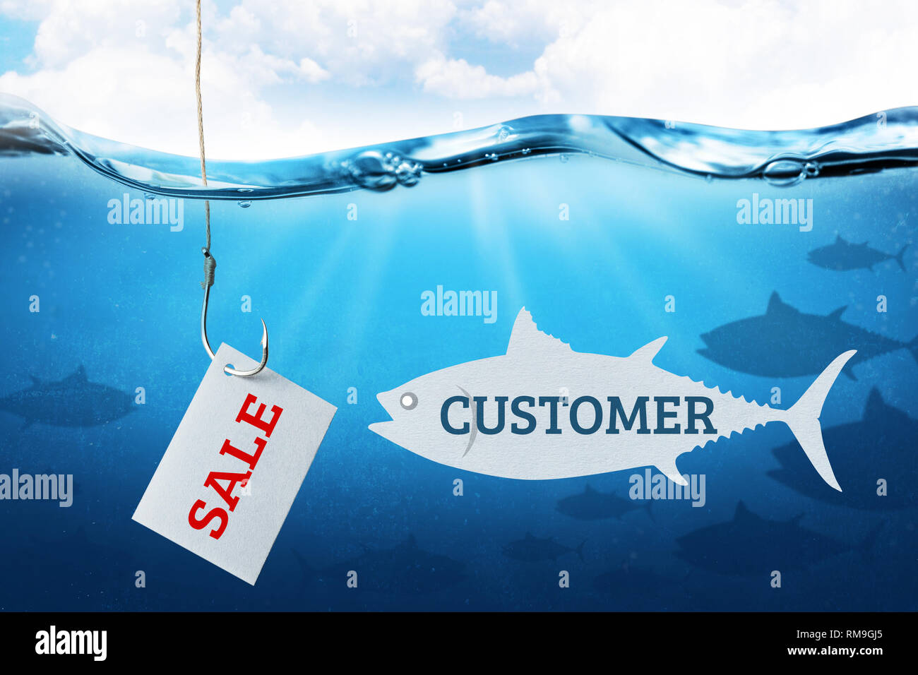 The inscription sale on the sheet as bait for buyers. Fishing hook with  fish bait as symbol of deception Stock Photo - Alamy