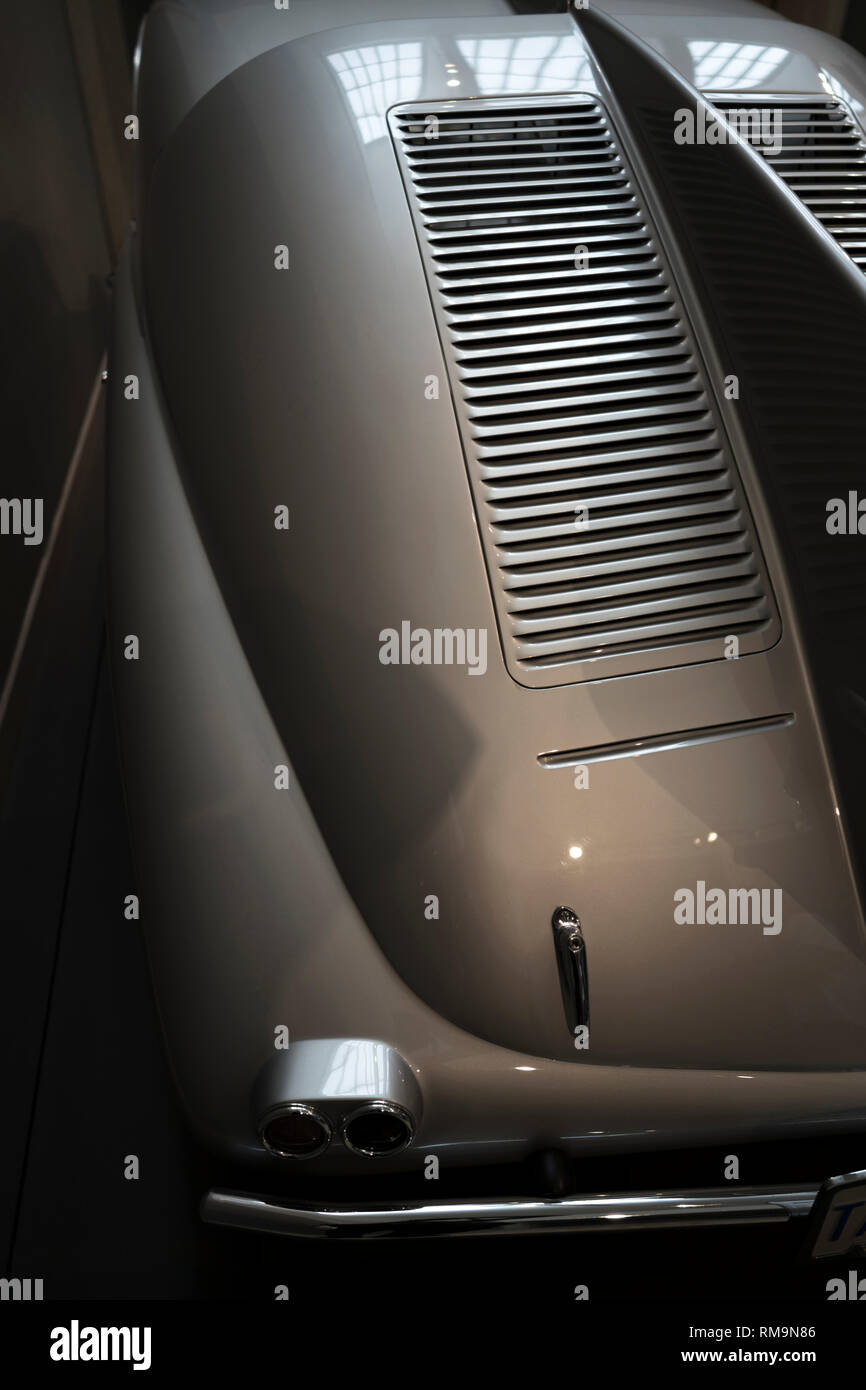 Old vintage car with a streamlined aerodynamic body shape with large fenders and convex lights