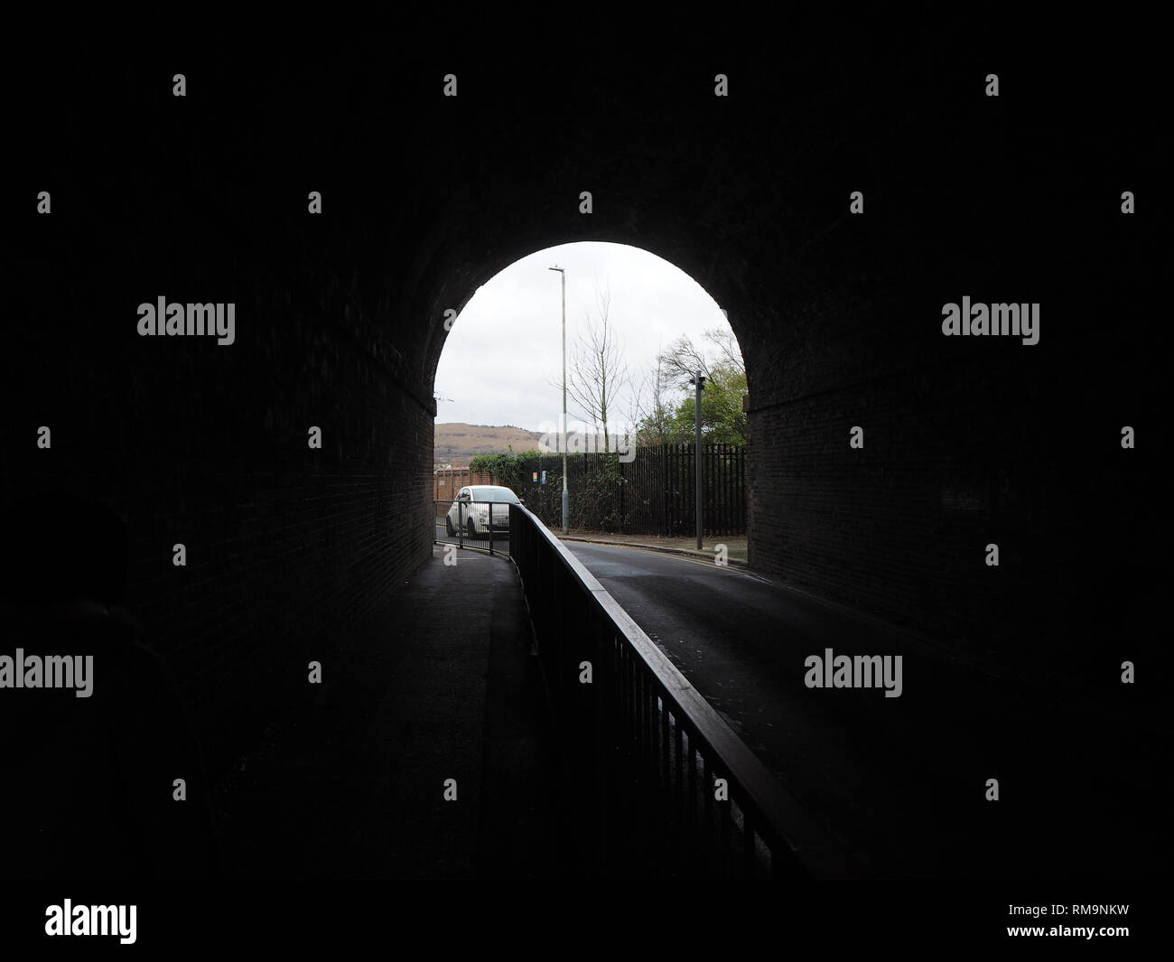 small road tunnel under railway arches Stock Photo Alamy