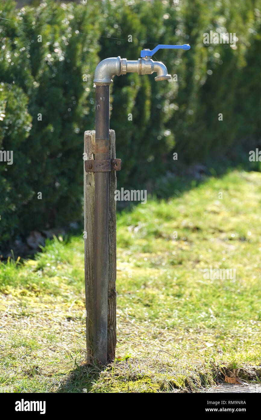an outdoor faucet in the garden, ideal for outdoor water, a connection for  a hose is available Stock Photo - Alamy