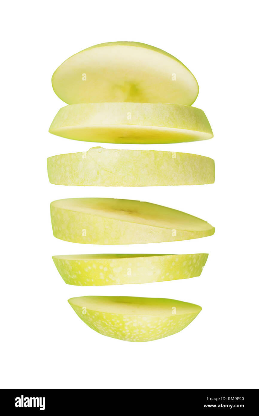 Sliced green apple flying. Isolated on white Stock Photo