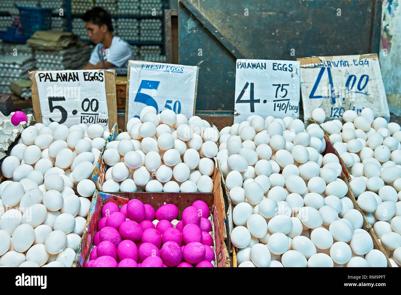 Young vendor selling white and red eggs at the Central Market in Puerto Princesa City, Palawan Province, Philippines Stock Photo
