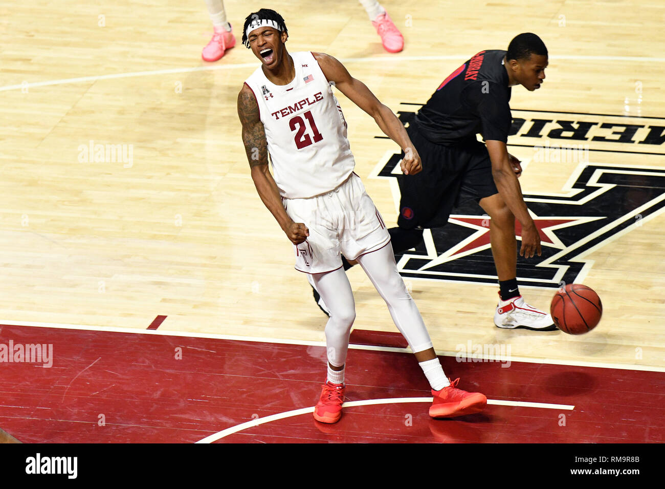 Philadelphia, Pennsylvania, USA. 13th Feb, 2019. Temple Owls forward JUSTYN HAMILTON (21) celebrates an empathic first half dunk during the American Athletic Conference basketball game played at the Liacouras Center in Philadelphia. Temple and SMU are tied at 34 at halftime. Credit: Ken Inness/ZUMA Wire/Alamy Live News Stock Photo