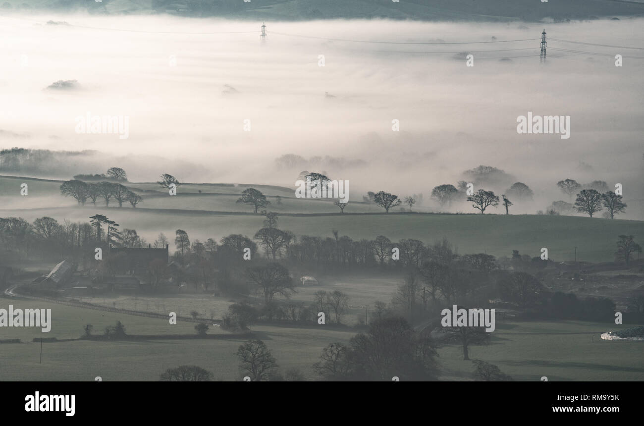 Marshwood Vale, Dorset, UK. 14th February 2019.  UK Weather: The early morning mist rises from the fields of Marshwood Vale on what promises to be a beautifully warm sunny Valentine's Day. Credit: Celia McMahon/Alamy Live News Stock Photo