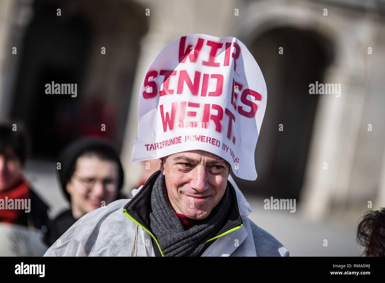 Munich, Bavaria, Germany. 14th Feb, 2019. ''We are worth it''- the motto of the Verdi union during strikes. To signify the failure of the second round of talks with employers, the German Verdi Ver.di labor union organized a 200  strong flashmob action at the famed Schloss Nymphenburg in Munich to kick off a new strike wave. Credit: ZUMA Press, Inc./Alamy Live News Stock Photo