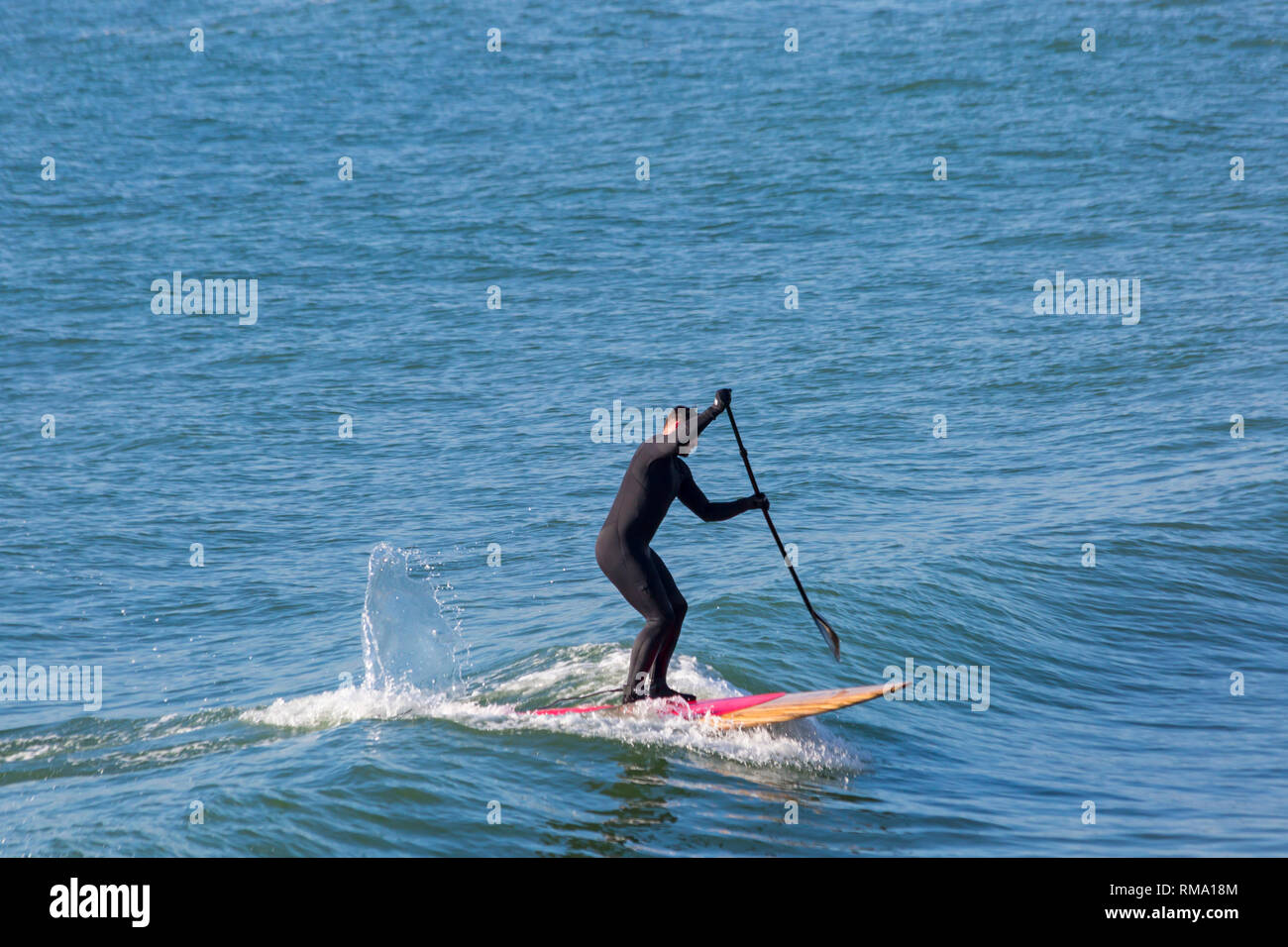 Paddleboarder on a wave hires stock photography and images Alamy