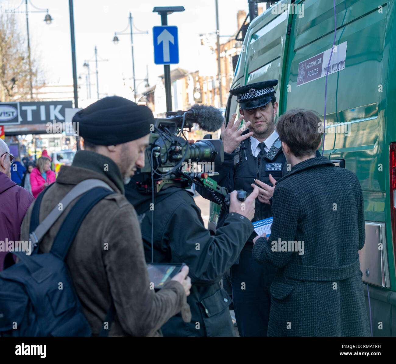 Romford London 14th February 2019. The second of the Metropolitan Police trials, outside Romford railway station, of the controversial live face recognition technology has taken place. It attracted international media interest with camera crews from Al Jazeera, Japan and France, among others, covering the trial. The facial recognition cameras scan passing pedestrians and if any of them are on a police 'watch list' they will be stopped. The last trial at Romford resulted in five arrests. Credit: Ian Davidson/Alamy Live News Stock Photo
