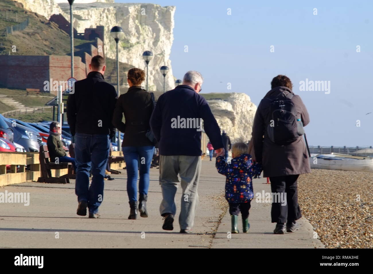 Seaford, East Sussex, UK. 14th Feb, 2019. People enjoying the bright warm sunshine on Seaford Beach. Credit: Peter Cripps/Alamy Live News Stock Photo