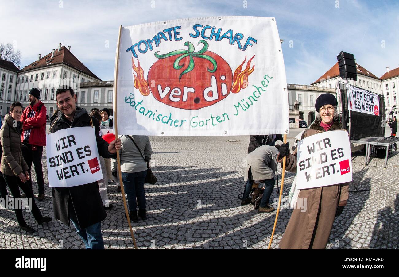 February 14, 2019 - Munich, Bavaria, Germany - To signify the failure of the second round of talks with employers, the German Verdi Ver.di labor union organized a 200+ strong flashmob action at the famed Schloss Nymphenburg in Munich to kick off a new strike wave.  The Union chose Castle Nymphenburg due to the pride and money Bavarian Ministerpresident Markus Soeder has invested into the castles of Bavaria, which in return have become major tourist attractions and income sources.  The union states that some of the money should be invested in the workers that that help keep these sites in opera Stock Photo
