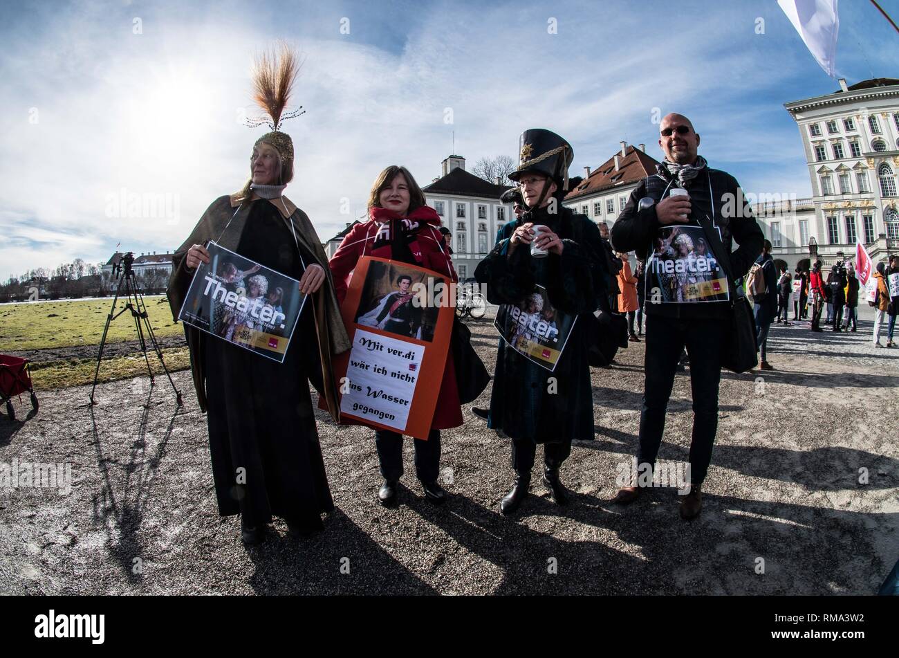 February 14, 2019 - Munich, Bavaria, Germany - Theatre workers joining in on the Verdi strike. To signify the failure of the second round of talks with employers, the German Verdi Ver.di labor union organized a 200+ strong flashmob action at the famed Schloss Nymphenburg in Munich to kick off a new strike wave.  The Union chose Castle Nymphenburg due to the pride and money Bavarian Ministerpresident Markus Soeder has invested into the castles of Bavaria, which in return have become major tourist attractions and income sources.  The union states that some of the money should be invested in the  Stock Photo