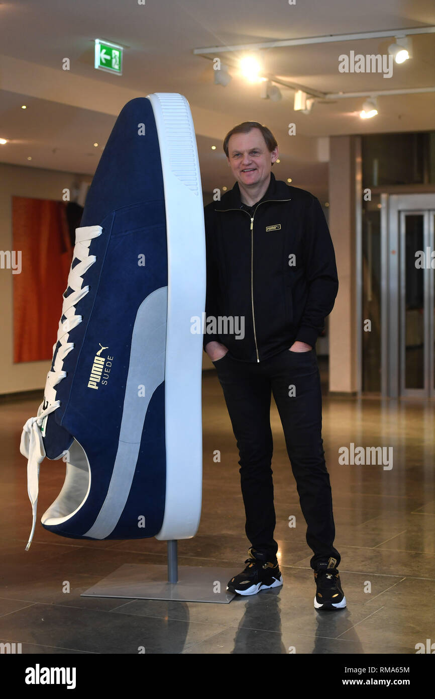 Bjoern GULDEN (CEO, Chairman of the Management Board) poses at huge PUMA  SUEDE sports shoes, single image, single image, half figure, half figure. PUMA  Bilanz Press conference on 14.02.2020 in Herzogenaurach. Sporting