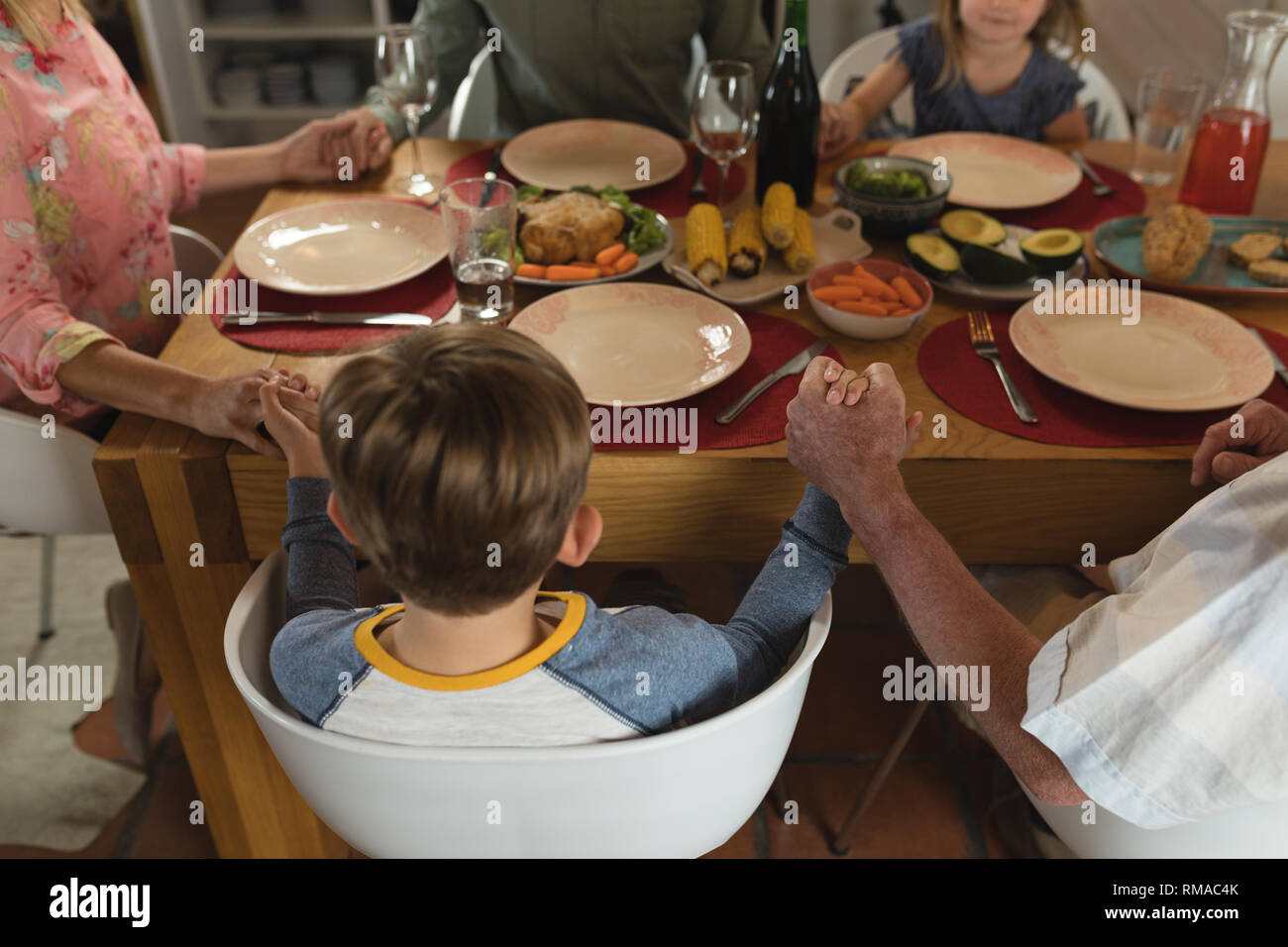 Family praying together meal dining hi-res stock photography and images ...