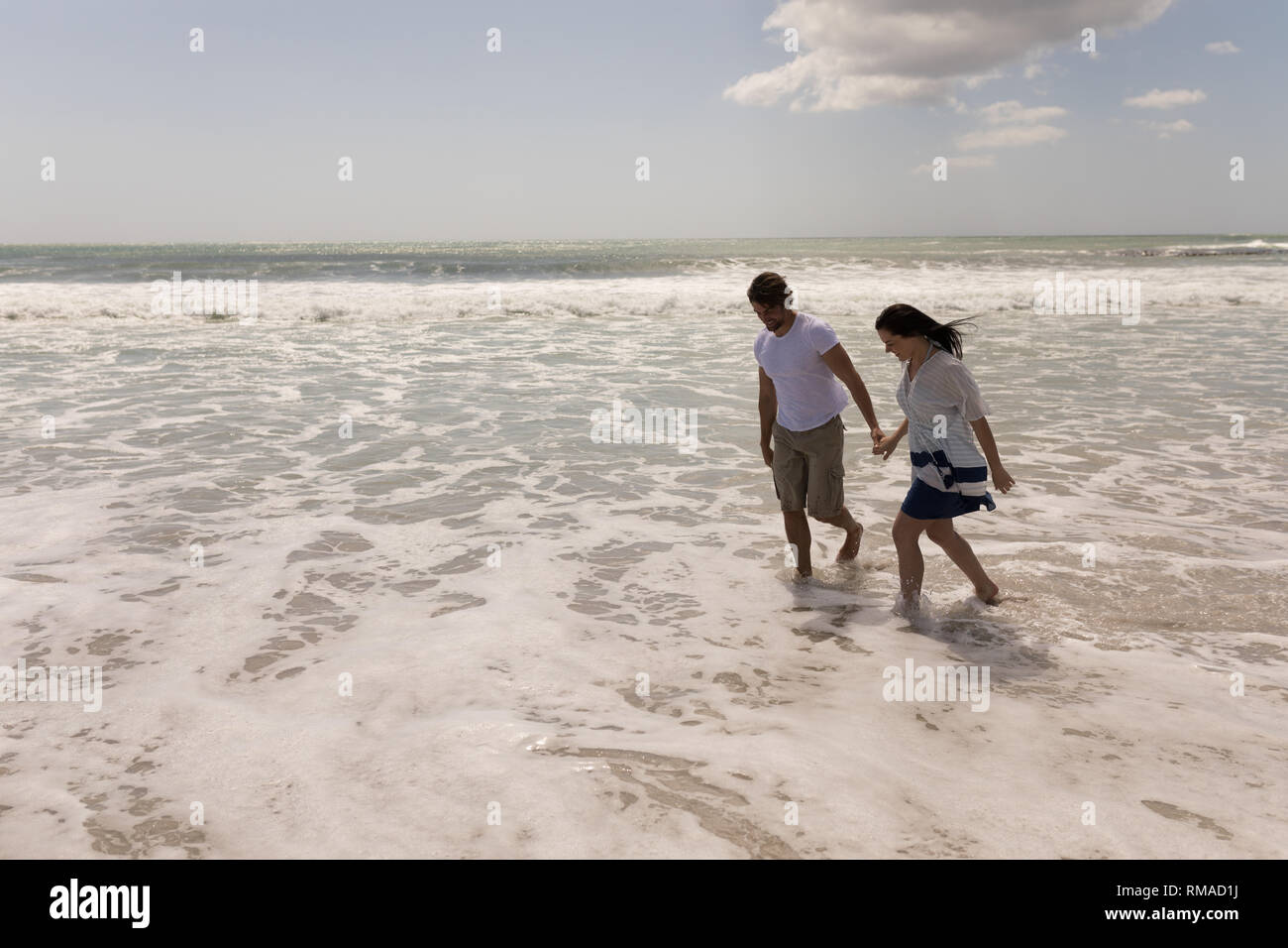 Smart couple holding hands hi-res stock photography and images - Alamy