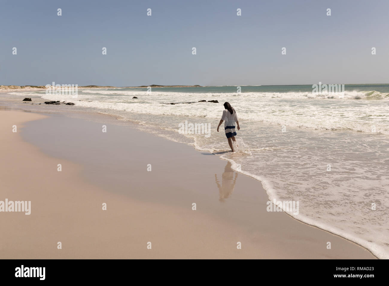 Woman walking barefoot beach hi-res stock photography and images - Alamy